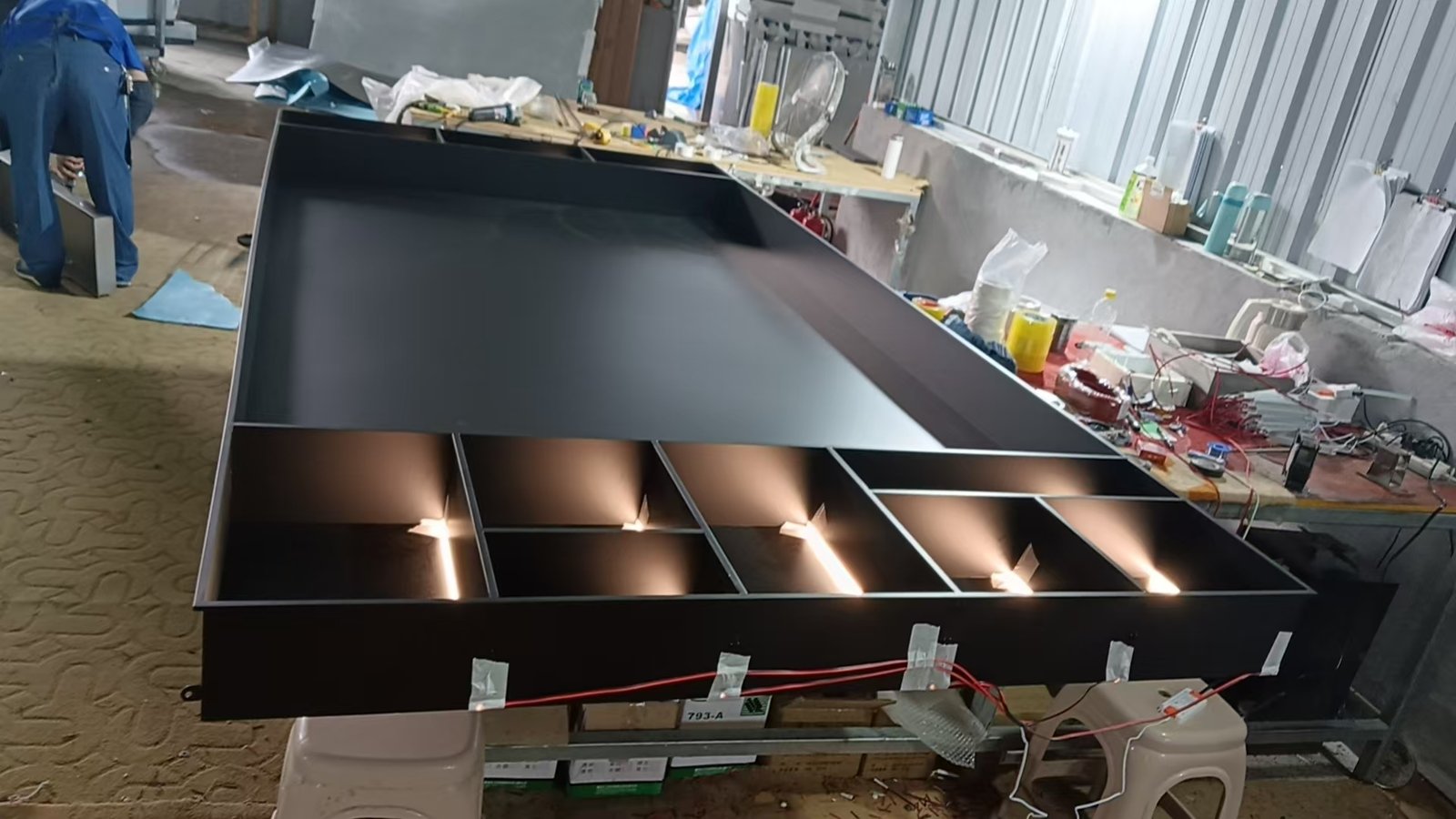 LED lighting test inside a custom black wall niche